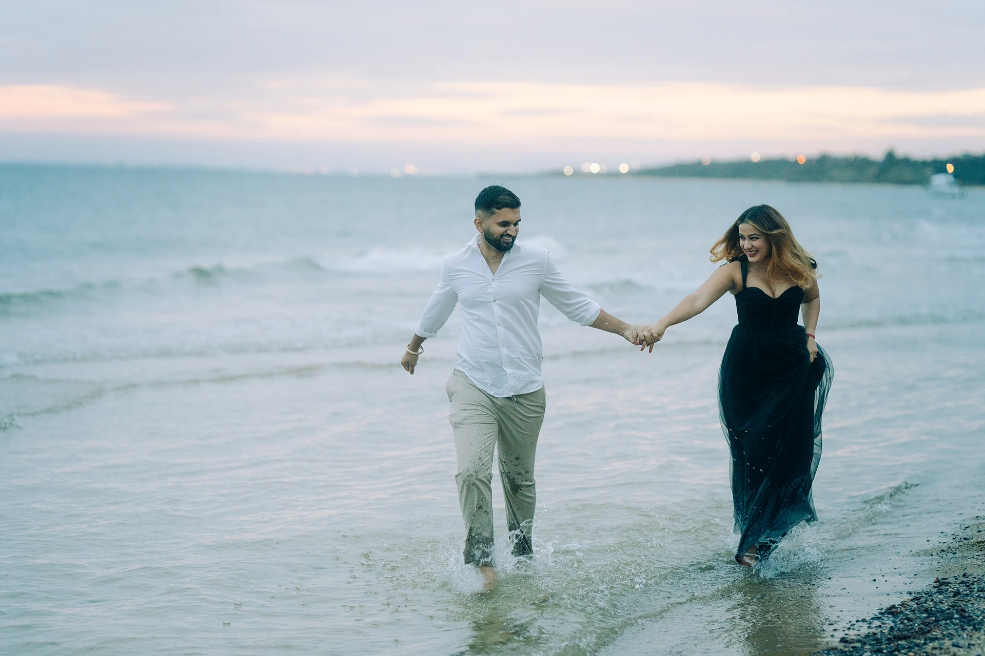 Elegant pre-wedding portrait of an South Asian couple at a beach