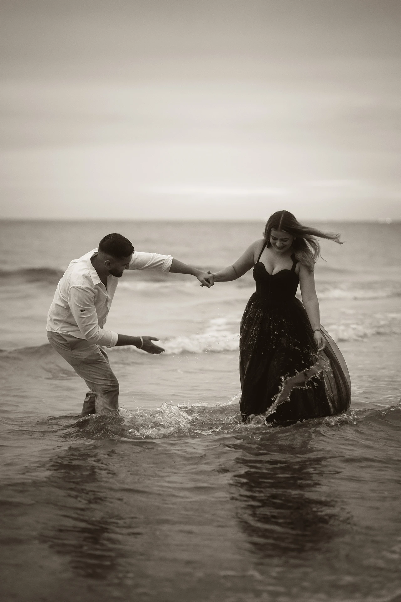 Elegant pre-wedding portrait of an South Asian couple at a beach