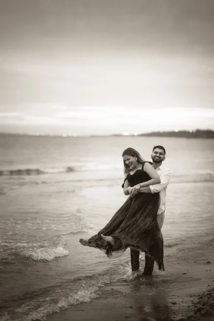 Elegant pre-wedding portrait of an South Asian couple at a beach
