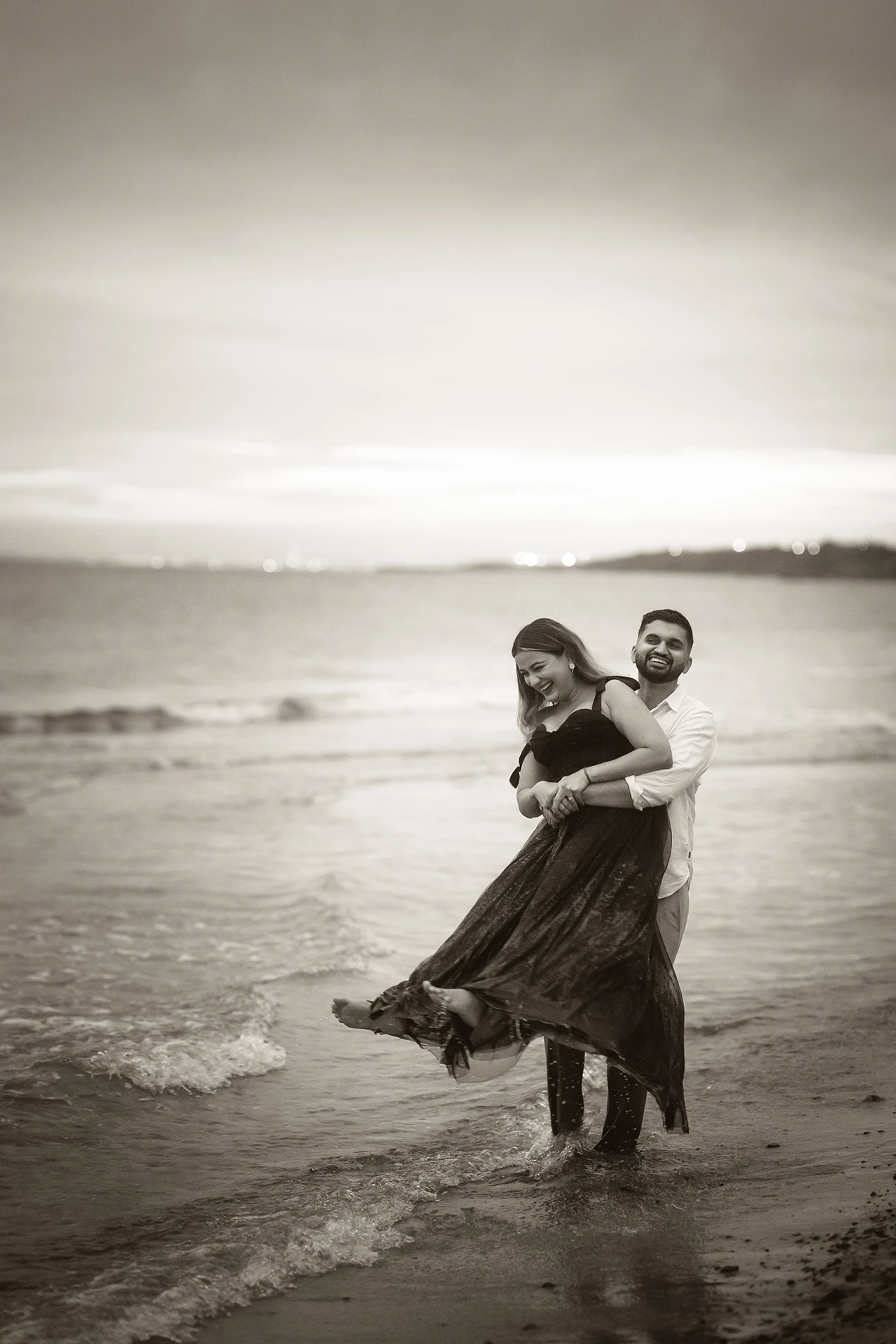 Elegant pre-wedding portrait of an South Asian couple at a beach
