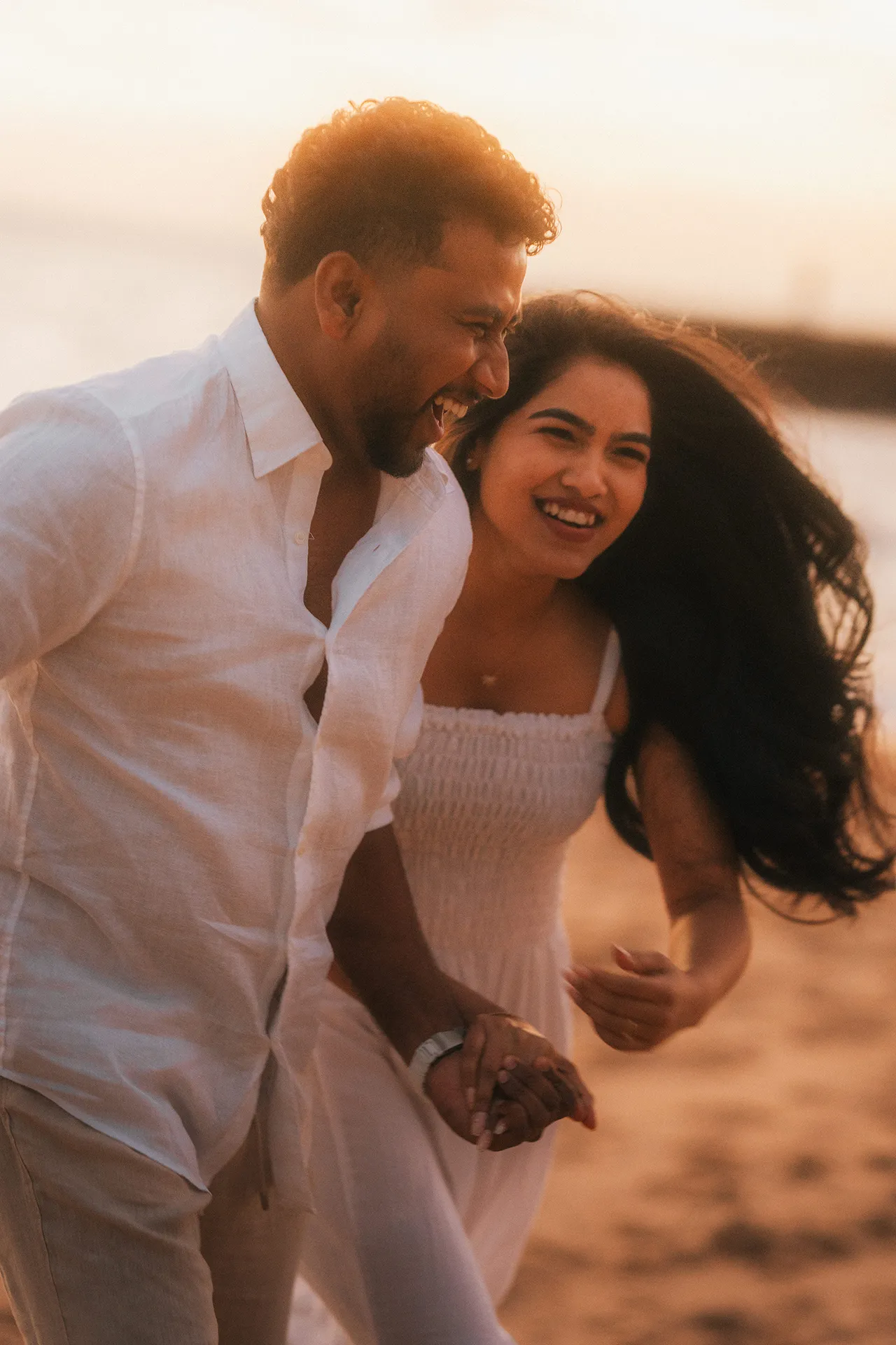 Romantic pre-wedding photoshoot on a Melbourne beach at sunset
